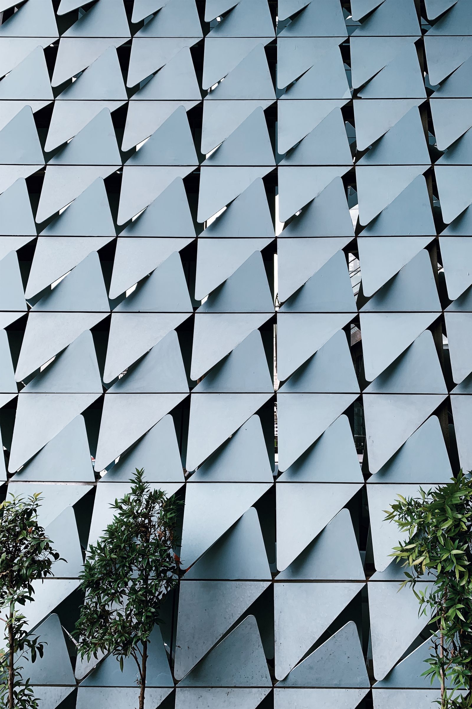 Modern facade detail with a clean geometric metal pattern